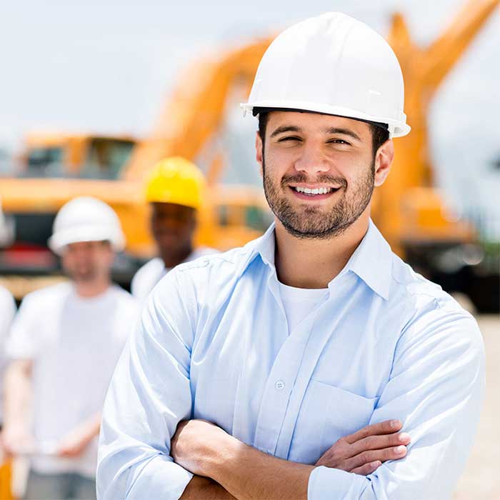 QIA home maintenance team leader with crew at construction site in Dammam